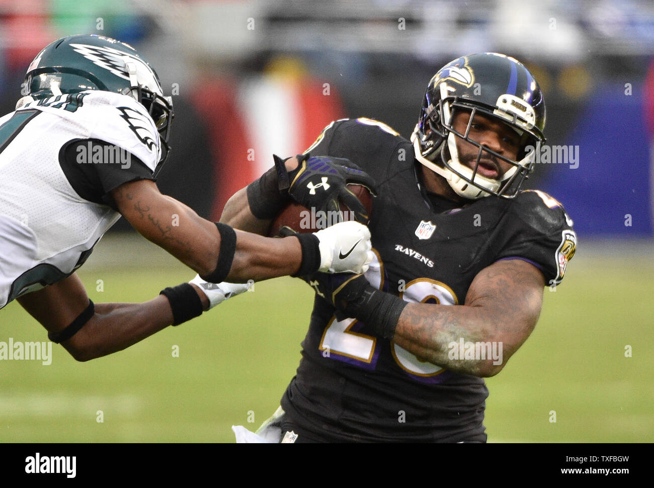 Philadelphia Eagles cornerback Leodis McKelvin (21) tries to strip the ball from Baltimore Ravens running back Terrance West (28) on s first down run during the first half of their NFL game at M&T Bank Stadium in Baltimore, Maryland, December 18, 2016. Photo by David Tulis/UPI Stock Photo