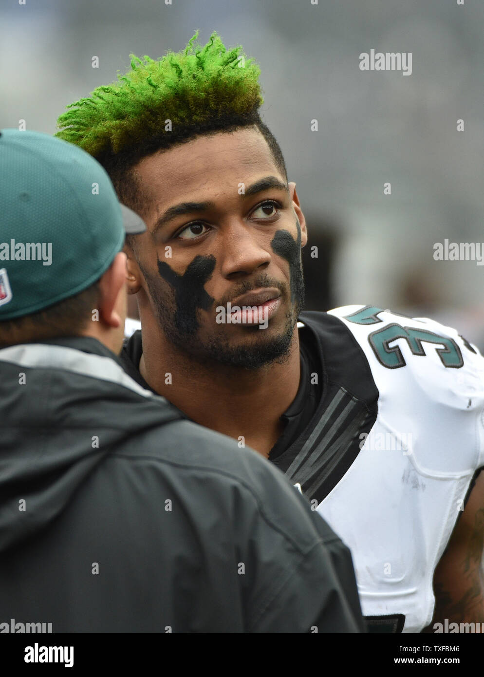 Philadelphia Eagles cornerback Jalen Mills wears green hair during the  first half of an NFL game against the Baltimore Ravens at M&T Bank Stadium  in Baltimore, Maryland, December 18, 2016. Photo by