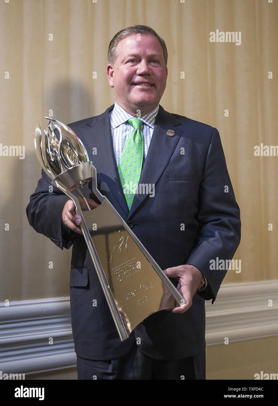 Notre Dame head coach Brian Kelly with the 2012 Coach of the Year award from Liberty Mutual Insurance Company January 6, 2013.  Notre Dame plays University of Alabama in the BCS National Championship in Miami Beach on January 7, 2013.  UPI/Mark Wallheiser Stock Photo