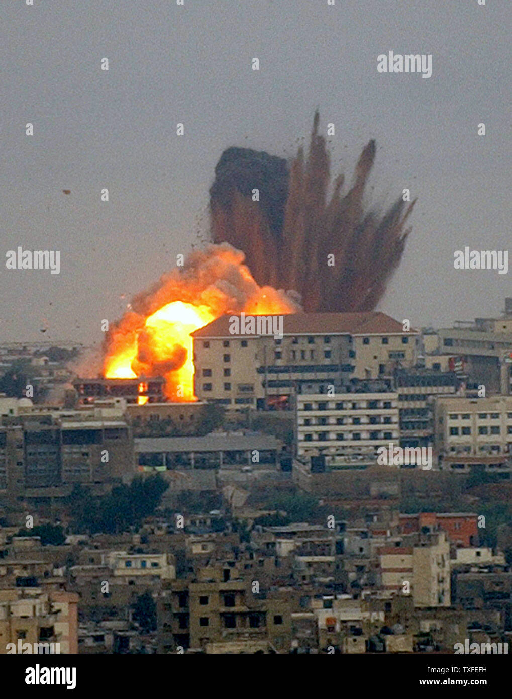 A Hezbollah youth and sports center in Ouzai, Beirut's southern suburbs, takes a direct hit by an Israeli bomb in the early hours of Friday August 4, 2006. In less than an hour the neighborhood of Ouzai took 19 Israeli missiles. In the north, along the coast highway four main bridges were knocked out cutting off Beirut from the northern part of Lebanon.   (UPI Photo) Stock Photo