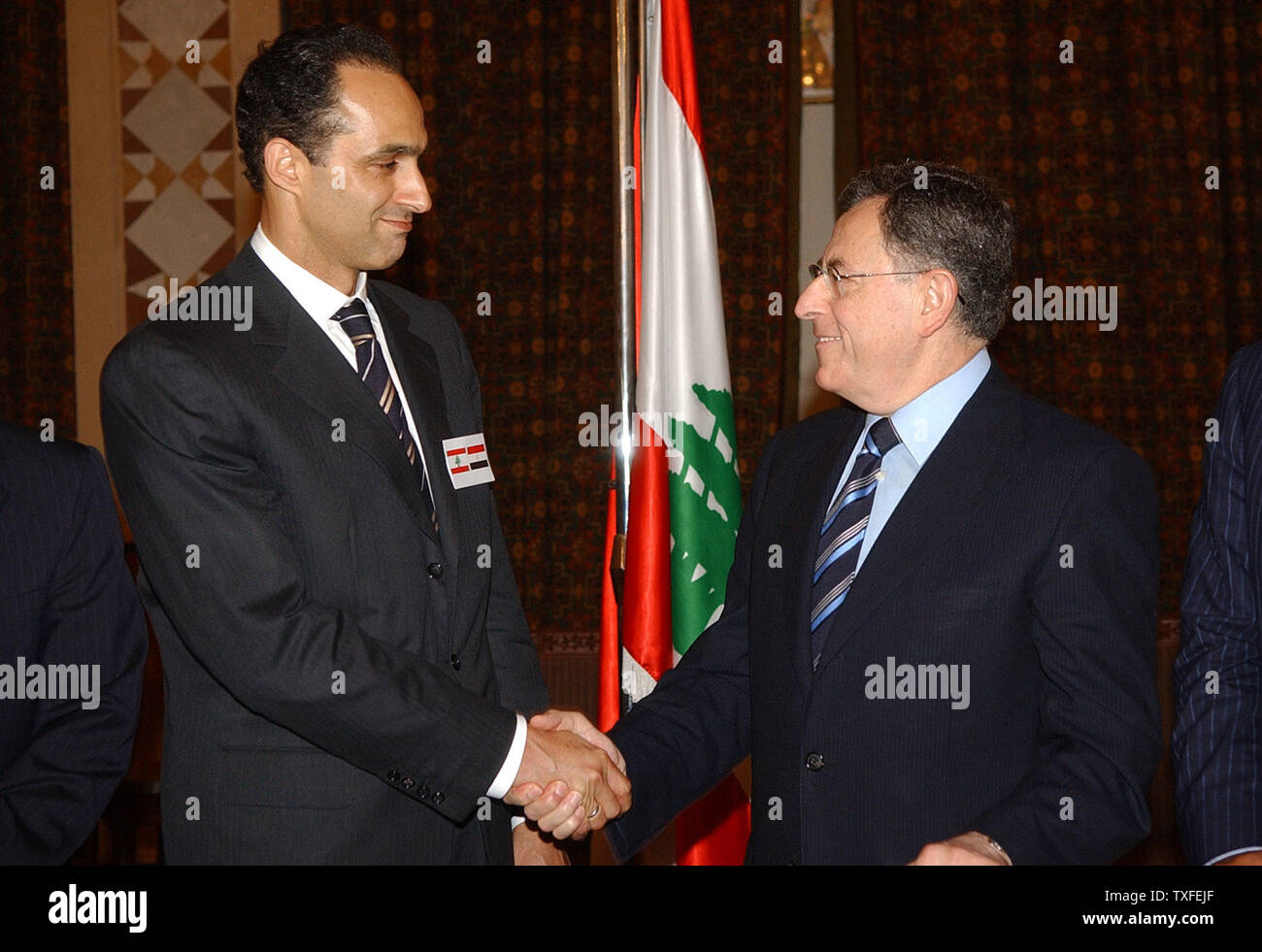 Gamal Mubarak (left), the son of Egyptian President Hosni Mubarak and his possible successor, meets with Lebanese Prime Minister Fouad Saniora in Beirut on August 8, 2006. Mubarak is wearing both the Lebanese and Egyptian flags on his lapel and is visiting Lebanon to show Egyptian solidarity with the Lebanese people. (UPI Photo) Stock Photo