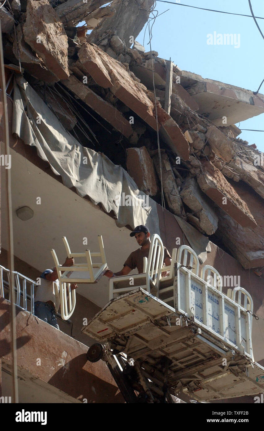 Residents of Beirut's southern suburbs remove furniture from their apartment in a destroyed building on August 24, 2006. The Hezbollah organization is paying people who have lost property a stipend to relocate until their own home can be rebuilt. (UPI Photo) Stock Photo