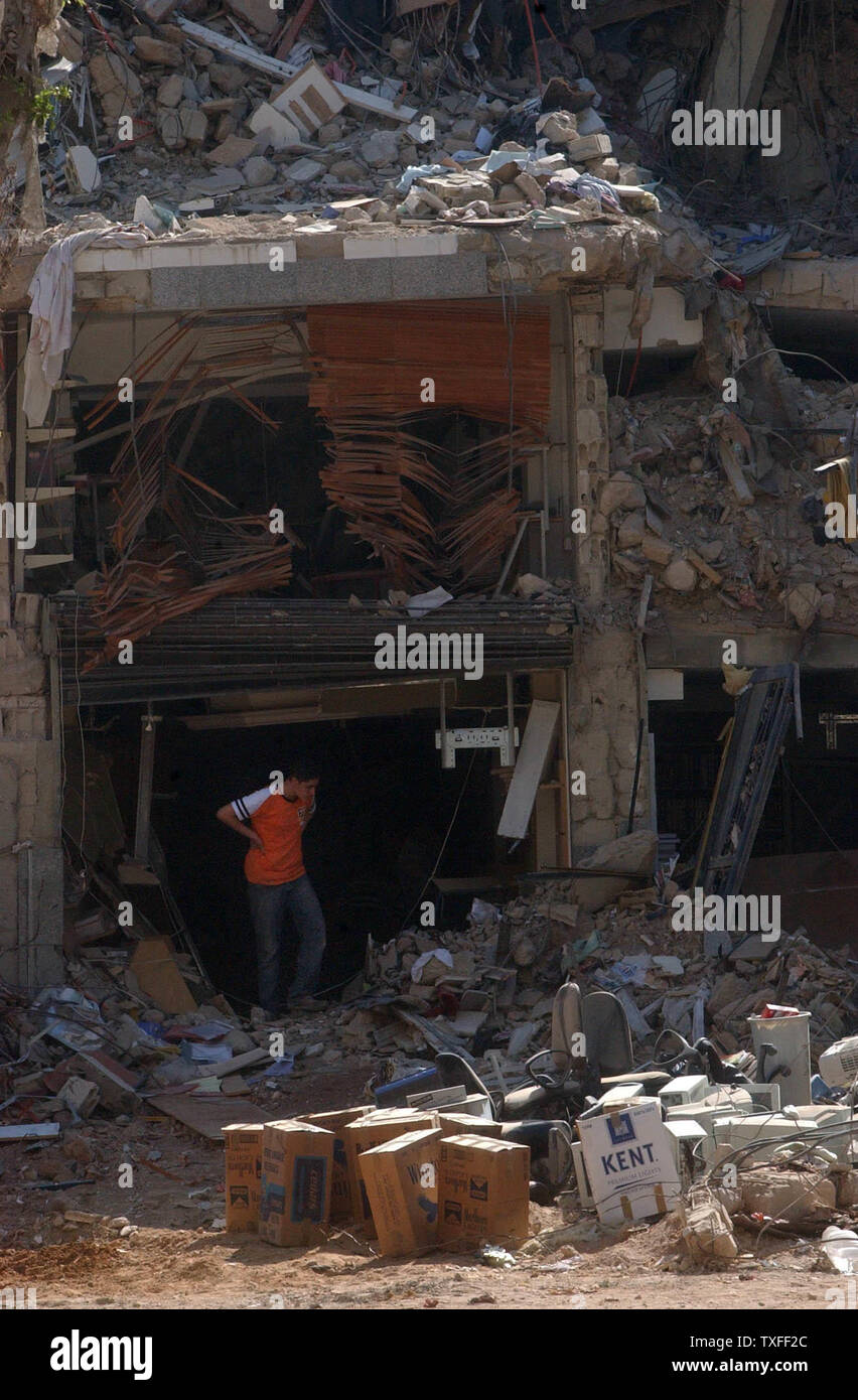 A resident of Beirut's southern suburbs takes a break from searching through the rubble of his building on August 24, 2006. The Hezbollah organization is paying people who have lost property a stipend to relocate until their own home can be rebuilt. (UPI Photo) Stock Photo