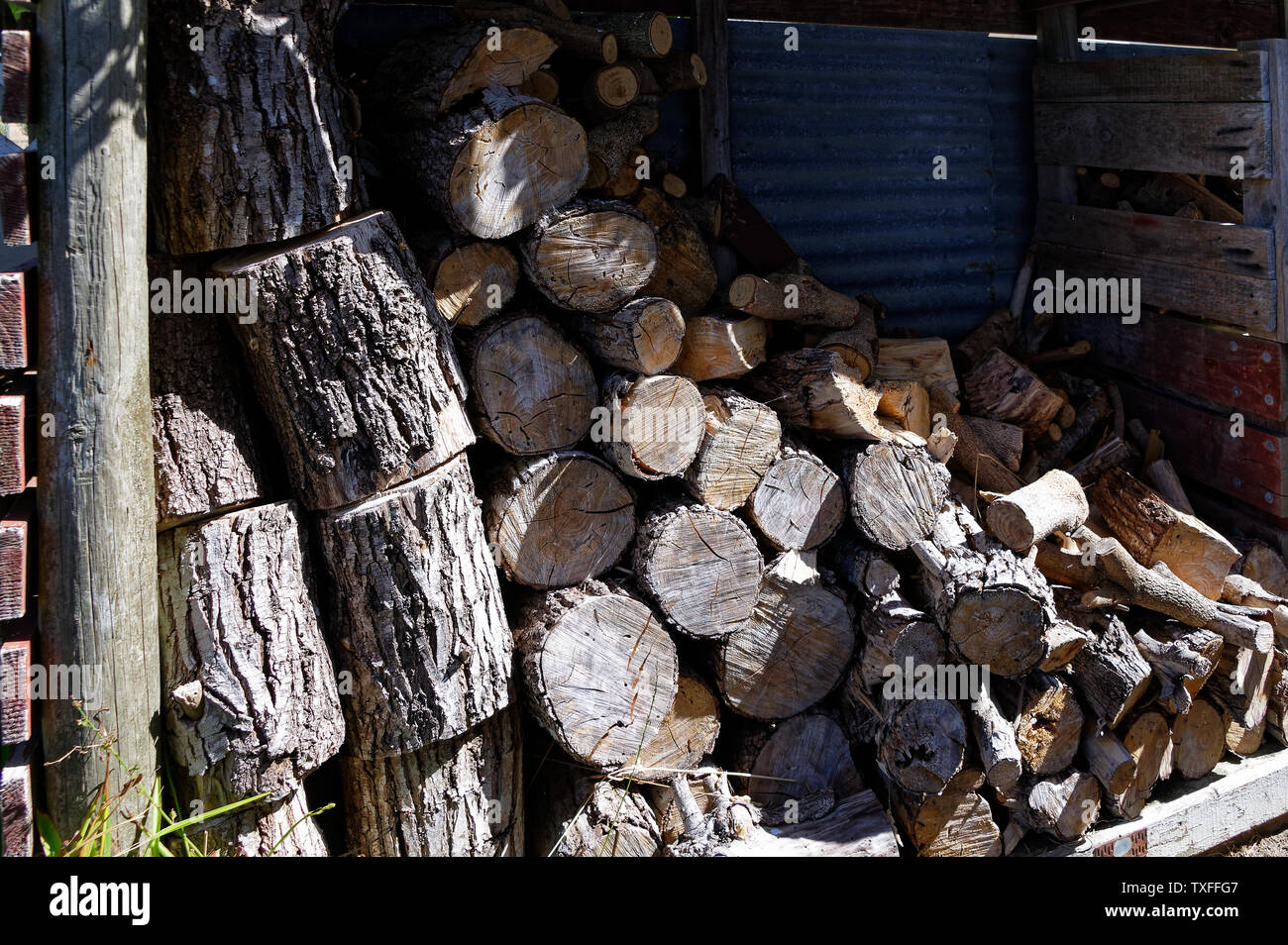 Fire fuel, firewood stacked in a shed Stock Photo Alamy