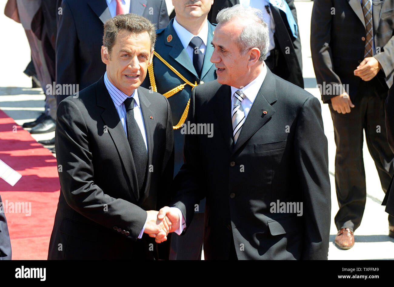 French President, Nicolas Sarkozy (L) is greeted by Lebanon’s recently elected president, Michel Suleiman at Beirut airport on June 7, 2008. Sarkozy is the first western head of state to meet Suleiman since the former army chief was elected president on May 25, following a Qatari-brokered deal to end the 18 month political stand off between the Lebanese government and the Hezbollah backed opposition. (UPI Photo) Stock Photo