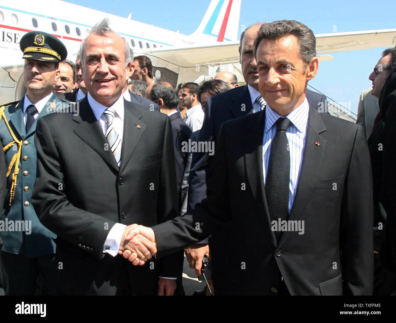 French President, Nicolas Sarkozy (R) is greeted by Lebanon’s recently elected president, Michel Suleiman at Beirut airport on June 7, 2008. Sarkozy is the first western head of state to meet Suleiman since the former army chief was elected president on May 25, following a Qatari-brokered deal to end the 18 month political stand off between the Lebanese government and the Hezbollah backed opposition. (UPI Photo/Dalati & Nohra) Stock Photo