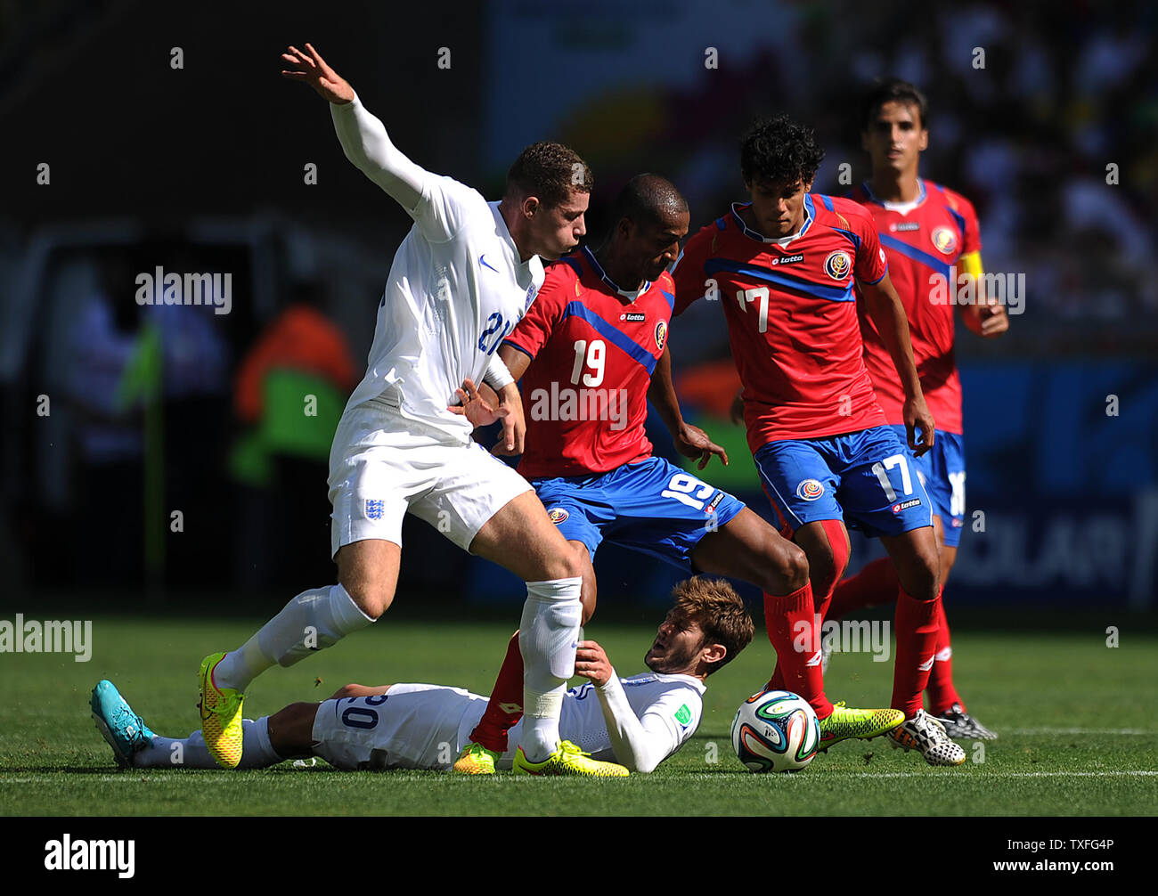 Joel Campbell of Costa Rica competes with Ross Barkley (L) of England