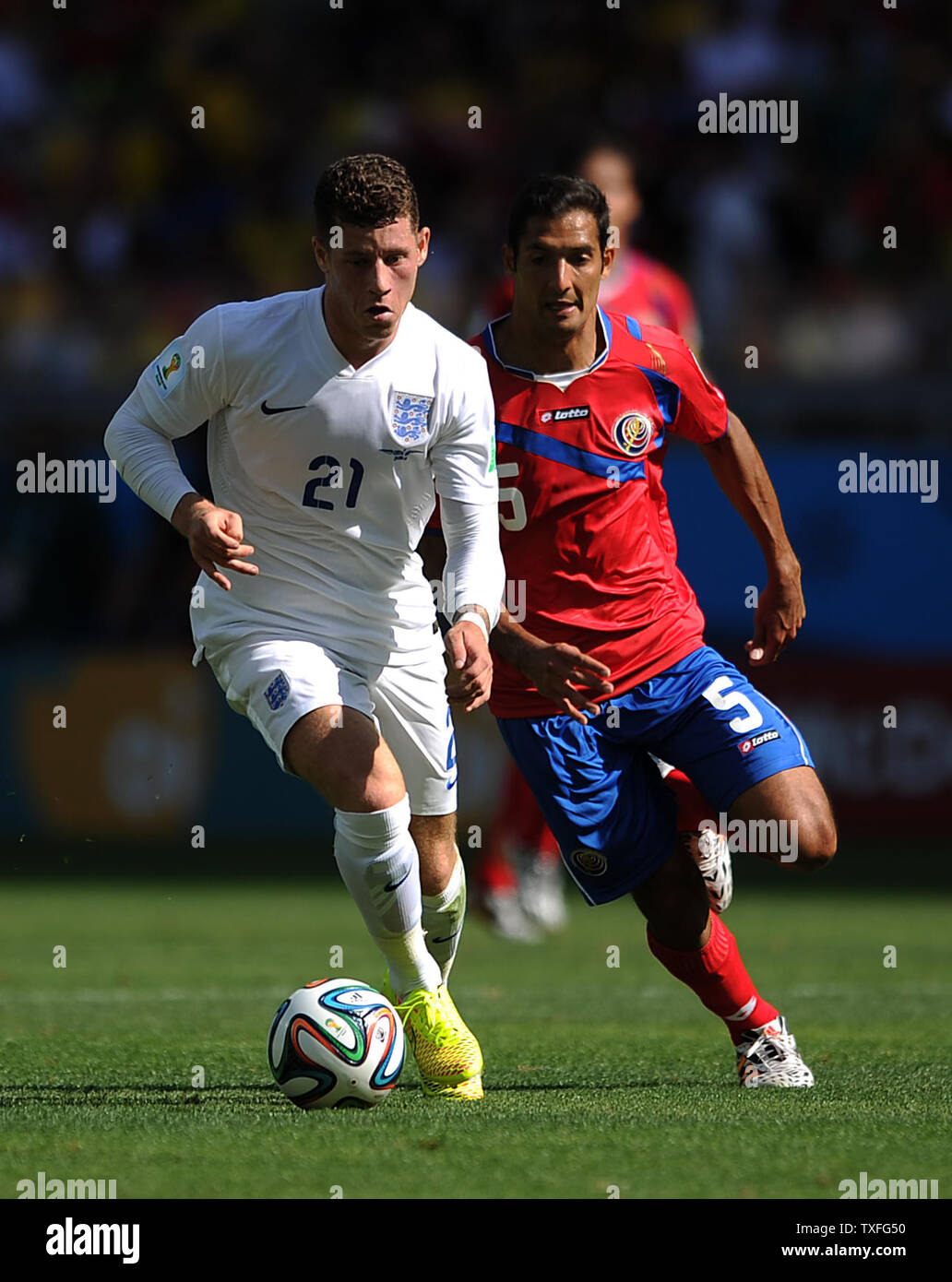 Celso Borges of Costa Rica chases Ross Barkley (L) of England during the 2014 FIFA World Cup Group D match at the Estadio Mineirao in Belo Horizonte, Brazil on June 24, 2014. UPI/Chris Brunskill Stock Photo
