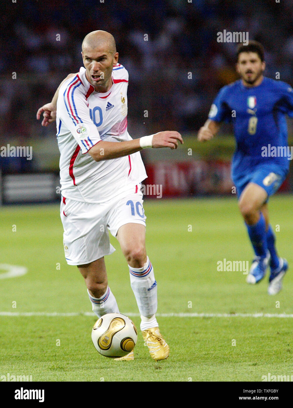 France's Zinedine Zidane dribbles the ball against Italy in the World Cup soccer final in Berlin, Germany on July 9, 2006. Italy is World Champion after defeating France 5-3. (UPI Photo/Arthur Thill) Stock Photo