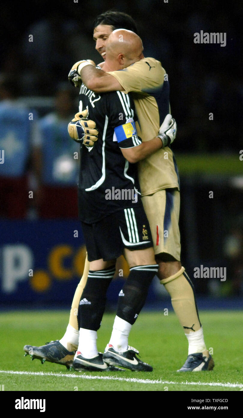 Keepers of both teams, Italy's Gianluige Buffon (R) and in black