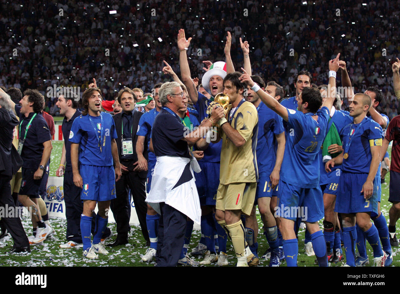 Italian players celebrate the World title as Giunluigi Buffon and Italy's coach Marcello Lippi hold the trophy at the World Cup soccer final in Berlin on July 9, 2006. Italy defeated France 5-3.   (UPI Photo/Arthur Thill) Stock Photo