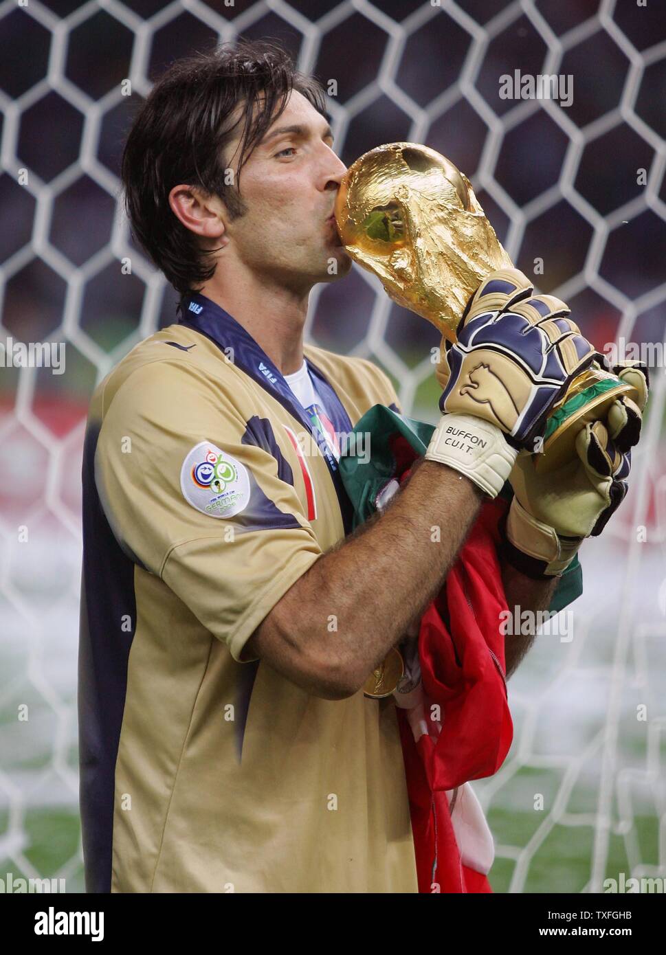 Italy's goalkeeper Gianluigi Buffon kisses the World Cup after the final of the FIFA World Cup and victory over France in Berlin on July 9, 2006. Italy won 5-3 in a penalty shoot out.  (UPI Photo/Christian Brunskill) Stock Photo