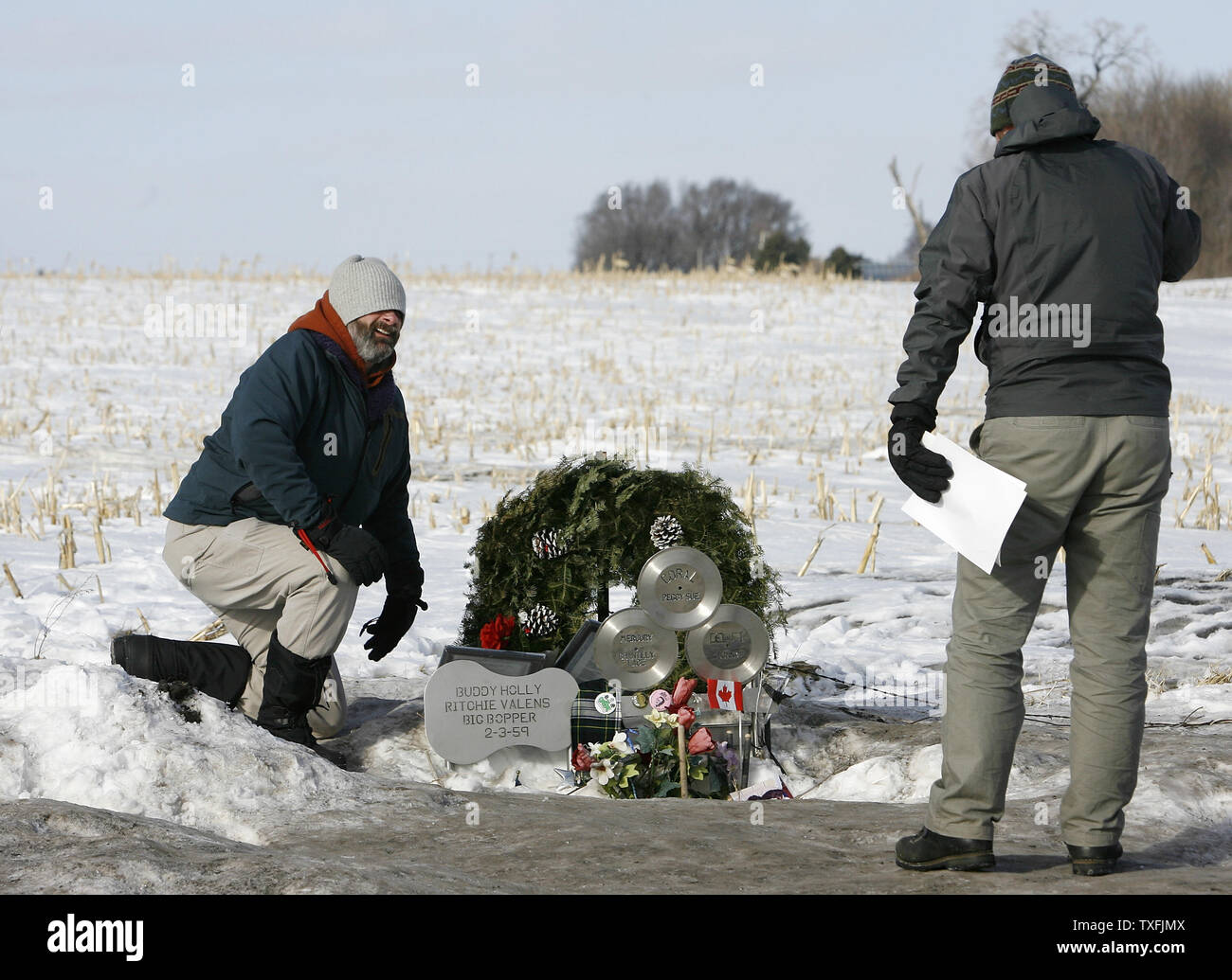 Mike Jones (R) and his dad Tom, both of Boston, take photos at the site of the plane crash that killed Buddy Holly, Ritchie Valens and J. P. 'The Big Bopper' Richardson near Clear Lake, Iowa on February 2, 2009. Singer Don McLean coined the phrase 'the day the music died' in his hit song American Pie referring to the death of the three rock 'n' roll pioneers in the early morning hours of February 3, 1959. Thousands of people descended upon Clear Lake to celebrate the 50th anniversary of 'the day the music died'.   (UPI Photo/Brian Kersey) Stock Photo