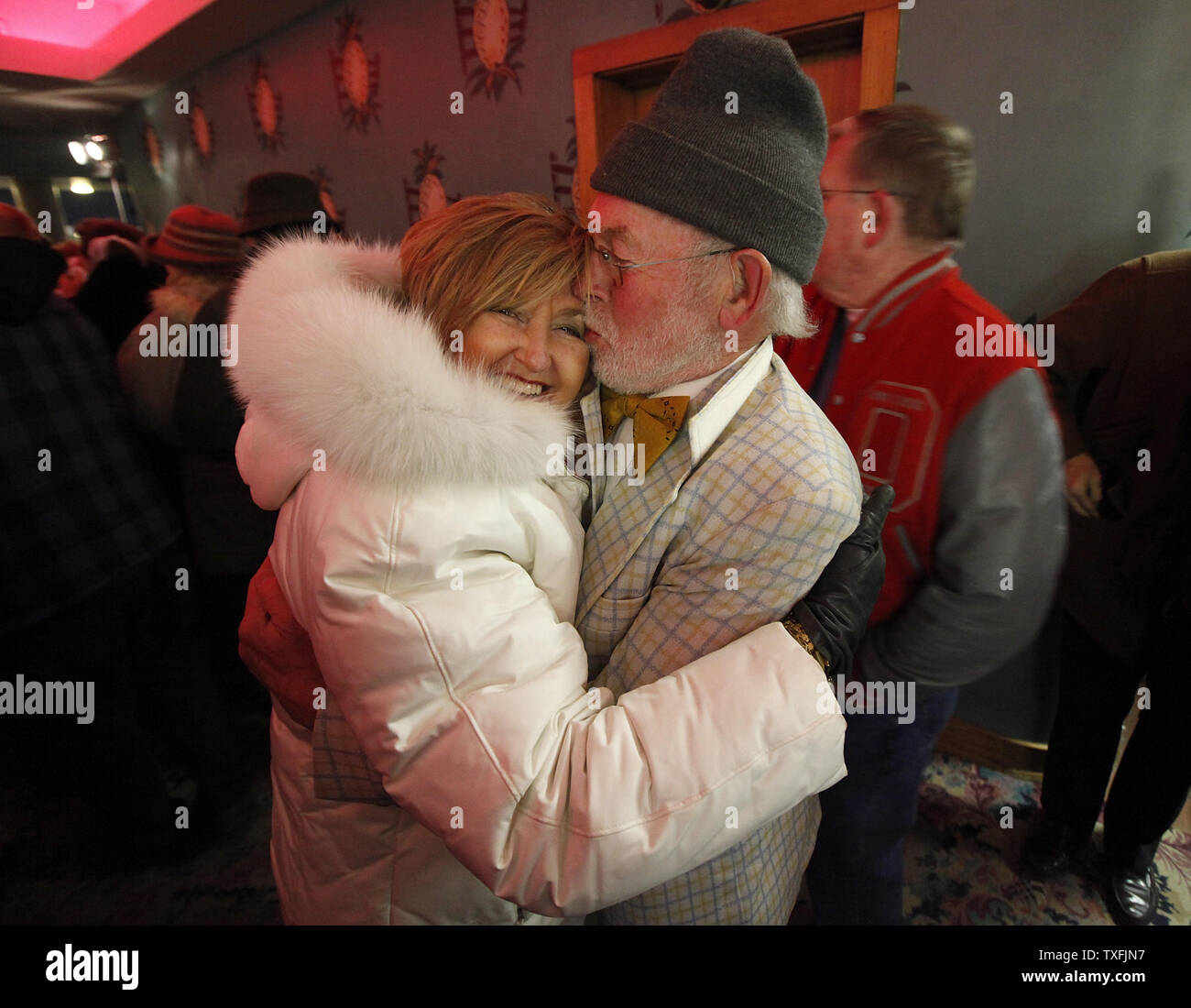 John Tobin kisses Cheryl Hausauer as they arrive at a tribute concert memorializing Buddy Holly, J.P. 'The Big Bopper' Richardson and Ritchie Valens at the Surf Ballroom in Clear Lake, Iowa on February 2, 2009. The three rock 'n' roll pioneers played their last show at the Surf Ballroom 50 years ago to the day. Singer Don McLean coined the phrase 'the day the music died' in his hit song 'American Pie' referring to the plane crash that killed the three stars in the early morning hours of February 3, 1959.  (UPI Photo/Brian Kersey) Stock Photo