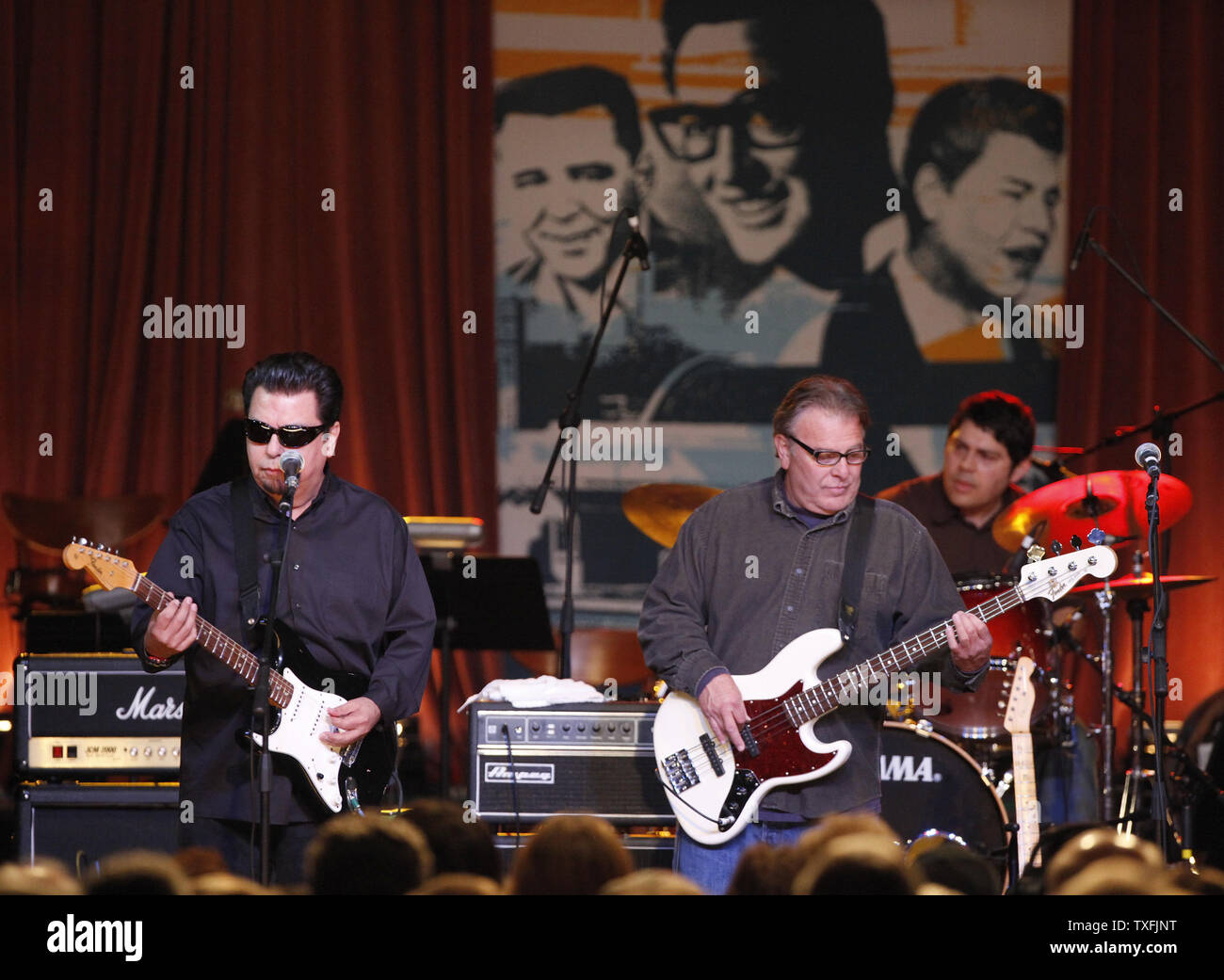 Cesar Rosas (L), Conrad Lozano (C) and Louie Perez of Los Lobos perform  during a tribute concert memorializing Buddy Holly, . 