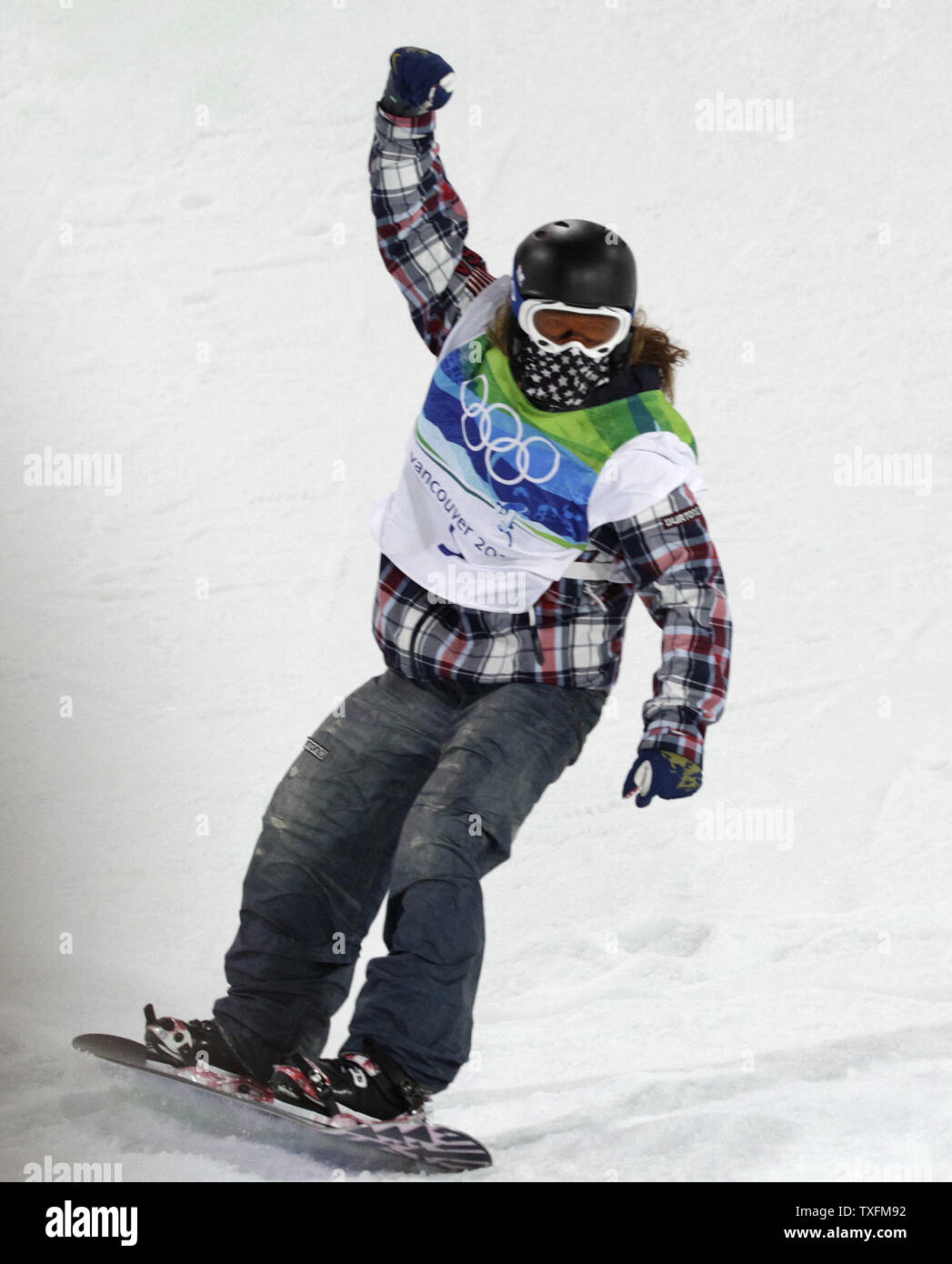Shaun White of the United States reacts after his first run in the