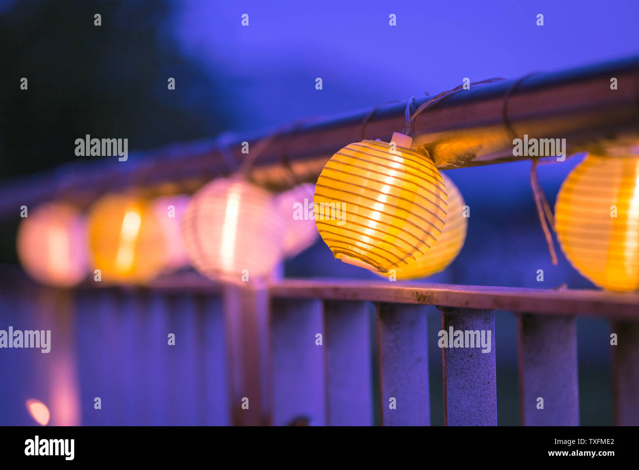 Colorful lampions outside, twilight hour, garden party Stock Photo Alamy