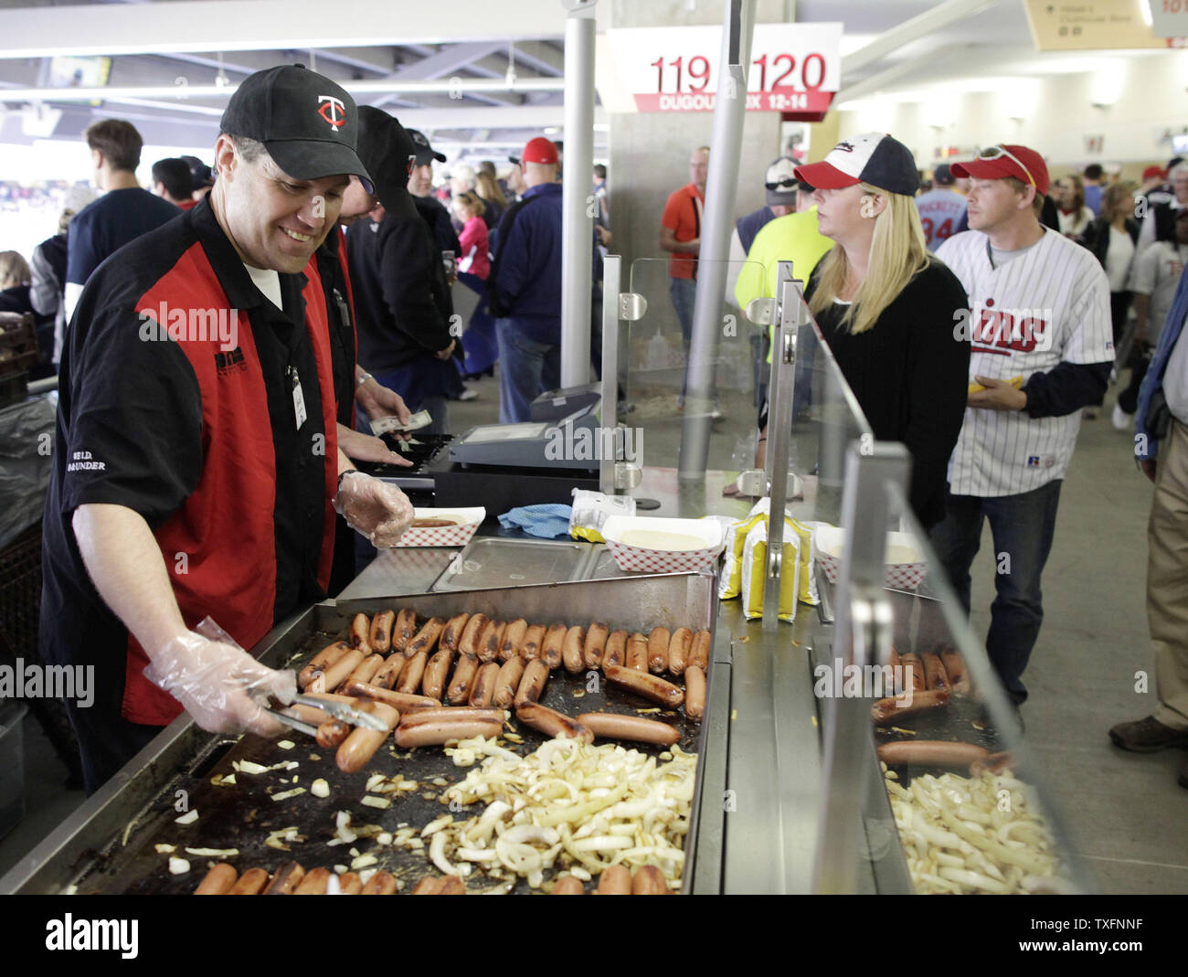 Vince O'Brein cooks up hot dogs on Opening Day at Target Field in Minneapolis on April 12, 2010. The new open-air ballpark made its official debut Monday as the Minnesota Twins beat the Boston Red Sox 5-2 in the game.    UPI/Brian Kersey Stock Photo