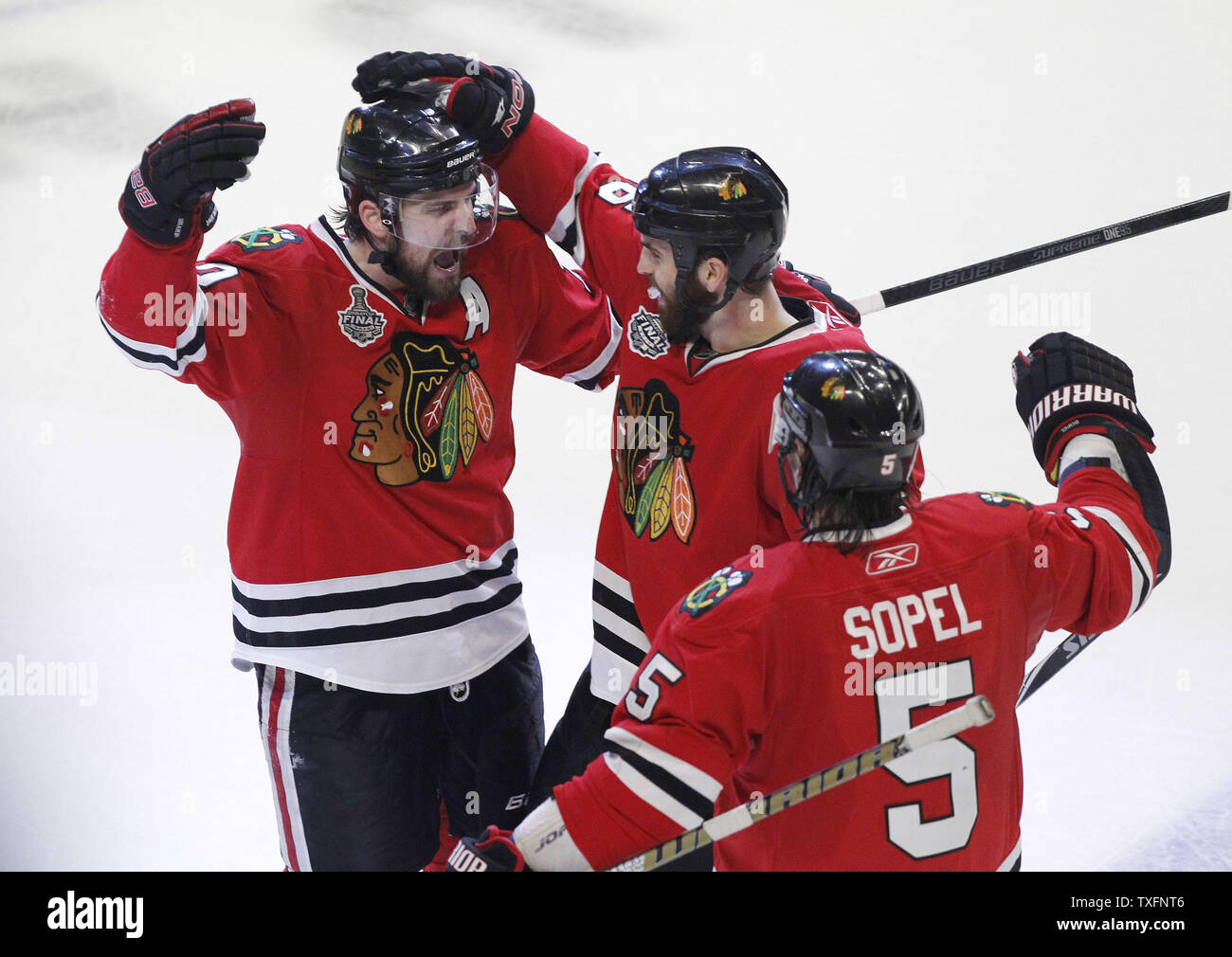 Chicago Blackhawks left wing Patrick Sharp (L), left wing Andrew Ladd (C) and defenseman Brent Sopel celebrate Sharps goal during the third period of game 5 of the 2010 Stanley Cup Final against the Philadelphia Flyers at the United Center in Chicago on June 6, 2010. The Blackhawks won 7-4 and lead the best of seven series 3-2.     UPI/Brian Kersey Stock Photo