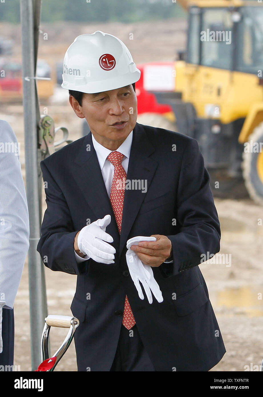 LG Chem Ltd. Vice-chairman and CEO Peter Bahn-Suk Kim prepares to toss some dirt at a groundbreaking ceremony for a new lithium-ion battery plant in Holland, Michigan on July 15, 2010. The $303 million facility run by LG Chem and Compact Power, Inc. is scheduled for completion in 2012 and is partially financed by a $151.4 million grant from the federal government as part of the stimulus package.       UPI/Brian Kersey Stock Photo