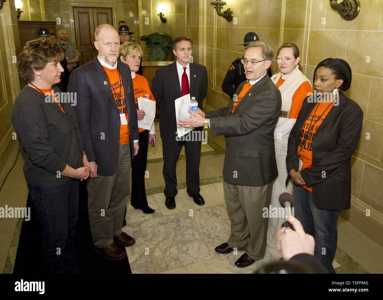 Wisconsin state assembly members lead by Rep. Peter Barca (center right) talks with Administration Secretary Michael Huebsch in front of the Governor's office at the state Capitol in Madison, Wisconsin on February 24, 2011. The lawmakers were requesting a meeting with Republican Gov. Scott Walker.  The state budget proposed by the governor  includes cuts in benefits for state workers and takes away many of their collective bargaining rights.     UPI/Brian Kersey Stock Photo