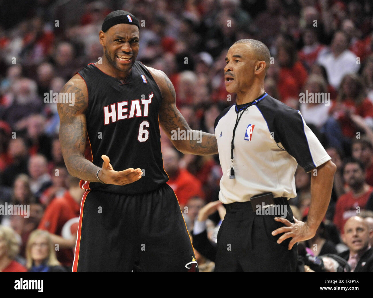 Miami Heat forward LeBron James (L) argues with referee Dan Crawford during  the fourth quarter of game 1 of the Eastern Conference Finals against the  Chicago Bulls at the United Center in