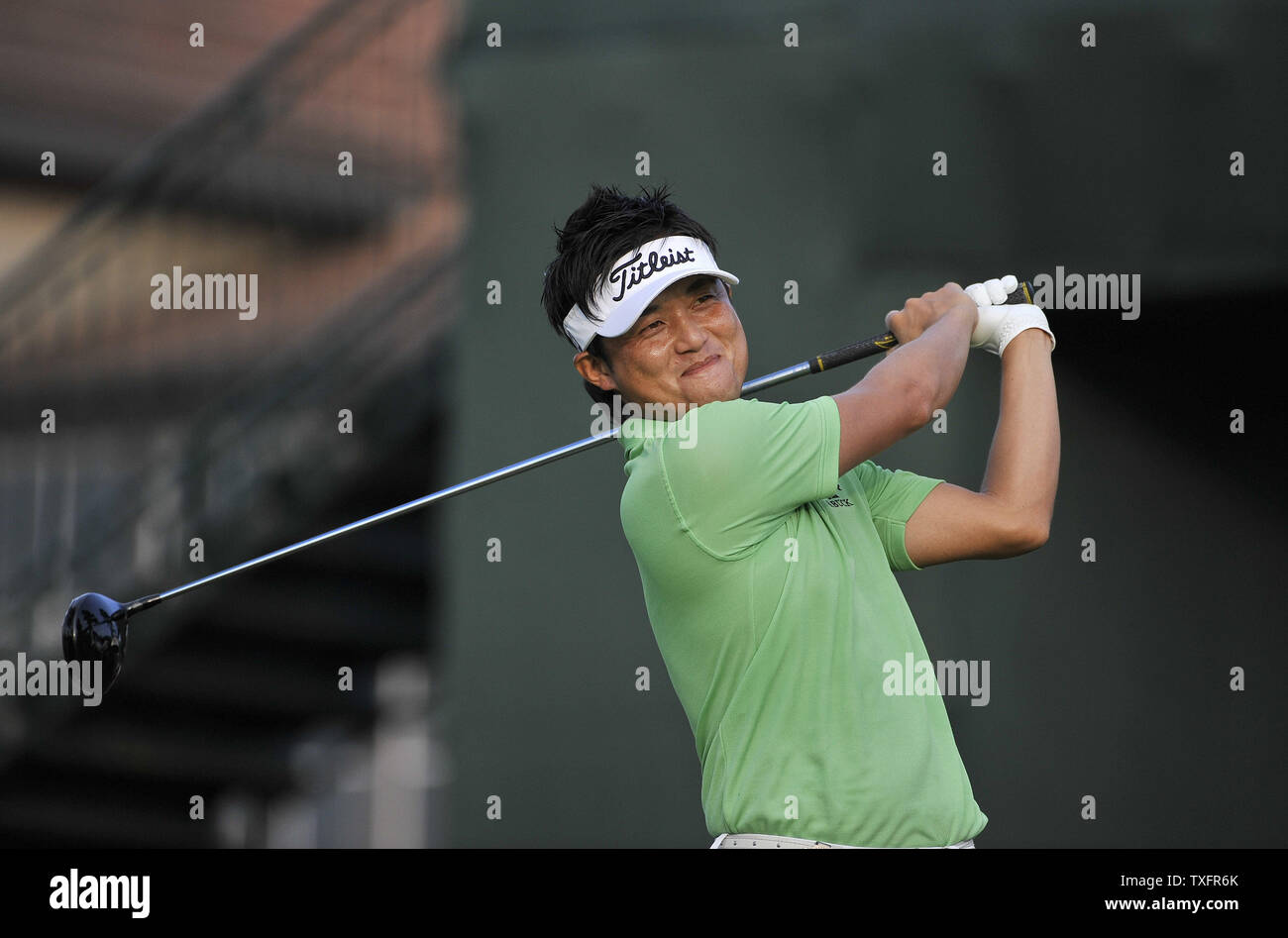 Ryuji Imada Of Japan Smiles As He Takes A Practice Swing On