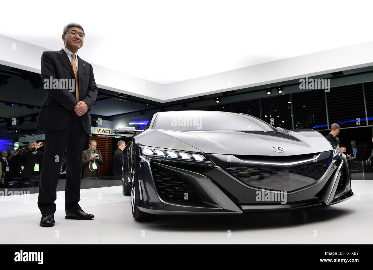 Kaichi Fukuo, Managing Officer of Honda Motor Company, stands with the Acura NSX concept at the 2013 North American International Auto Show in Detroit on January 15, 2013.    UPI/Brian Kersey Stock Photo