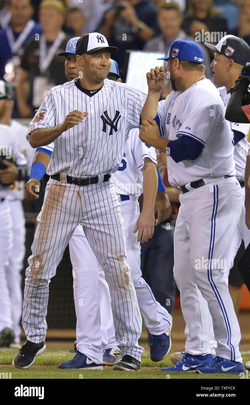 American League All-Stars Derek Jeter, of the New York Yankees, (L) and Max  Scherzer, of the Detroit Tigers, celebrate their 5-3 win over the National  League after the 2014 MLB All Star