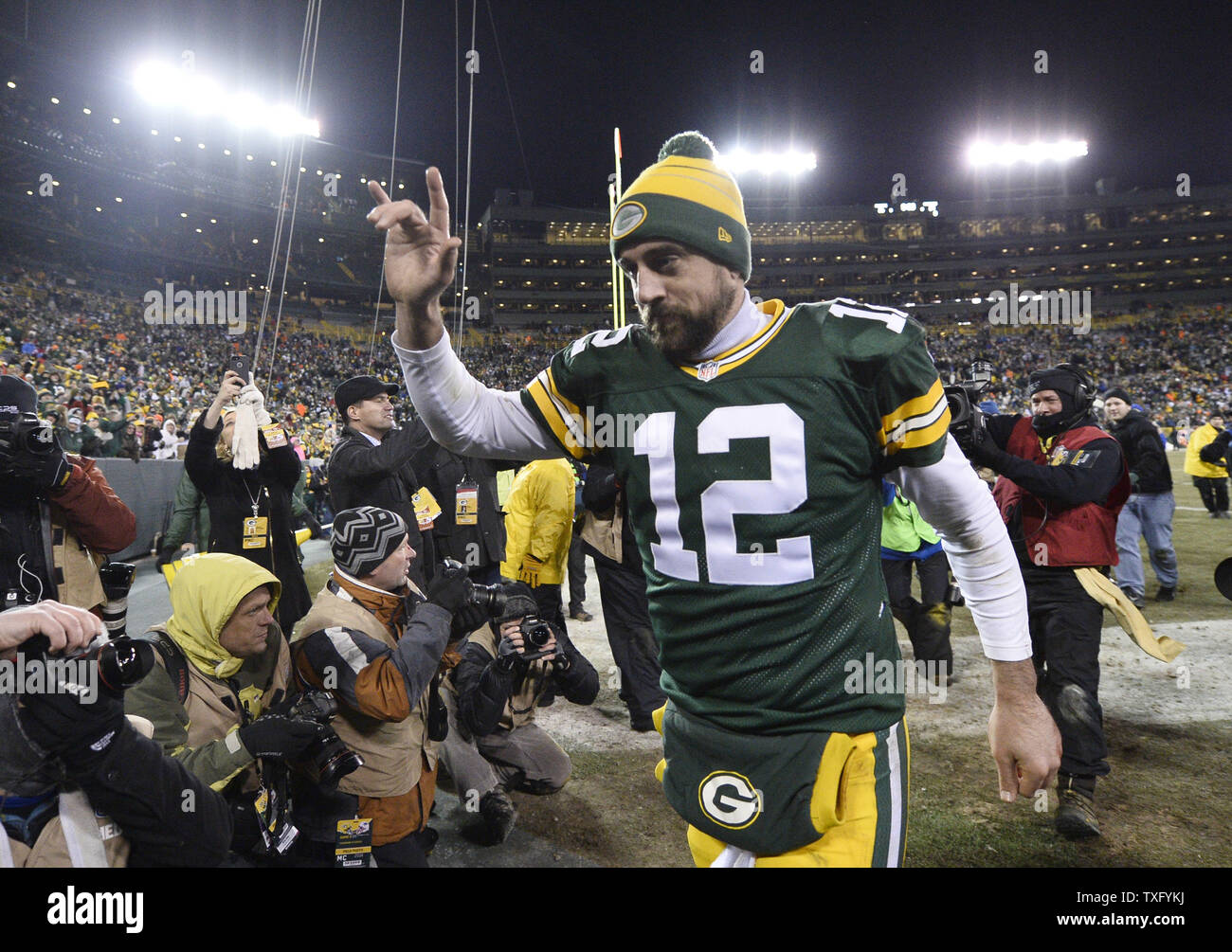 New England Patriots quarterback Tom Brady (R) hugs Green Bay Packers  quarterback Aaron Rodgers after their game at Lambeau Field on November 30,  2014 in Green Bay, Wisconsin. The Packers defeated the