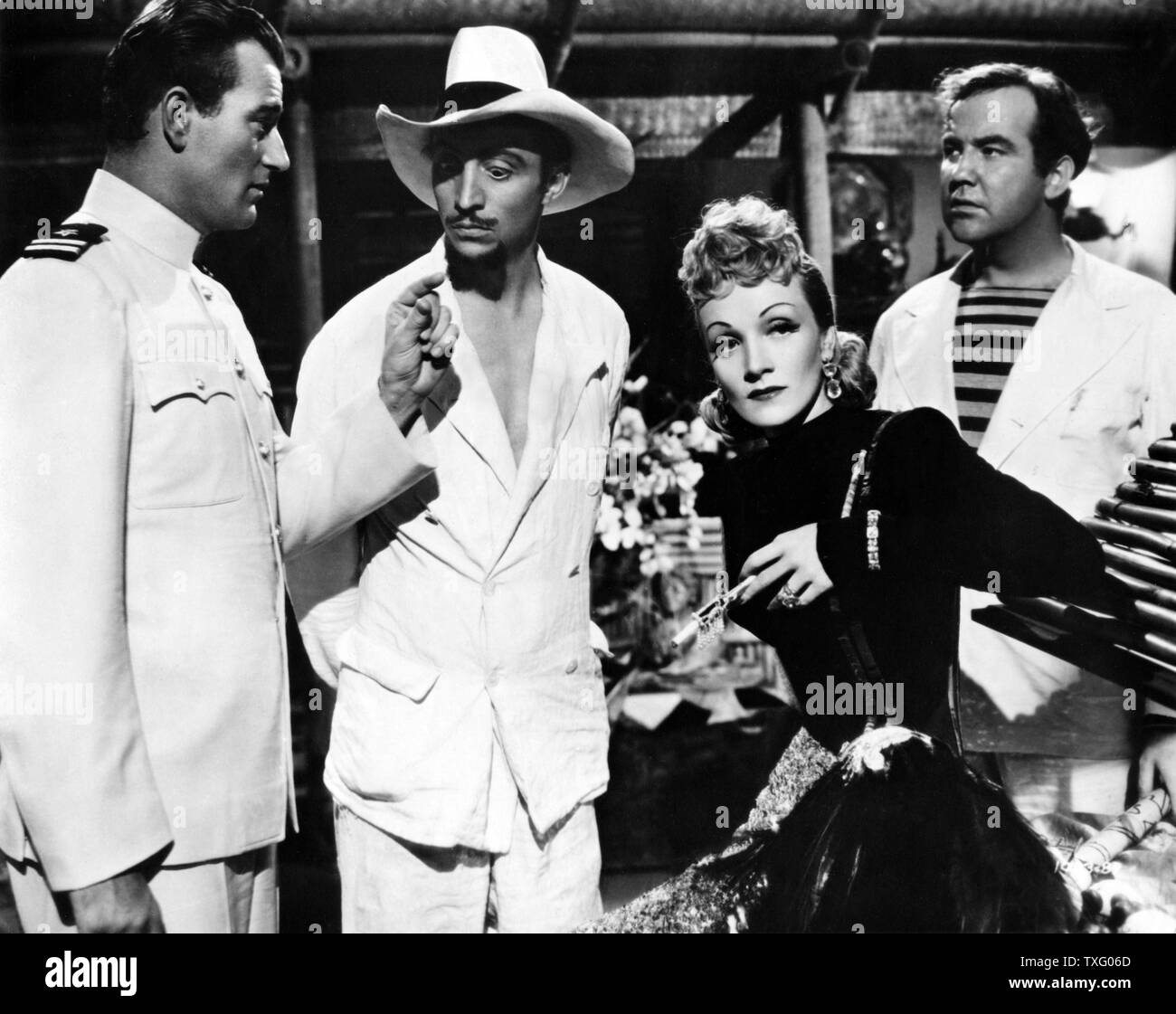 Seven Sinners Year : 1940 USA Director : Tay Garnett Marlene Dietrich, John Wayne, Mischa Auer, Broderick Crawford Stock Photo