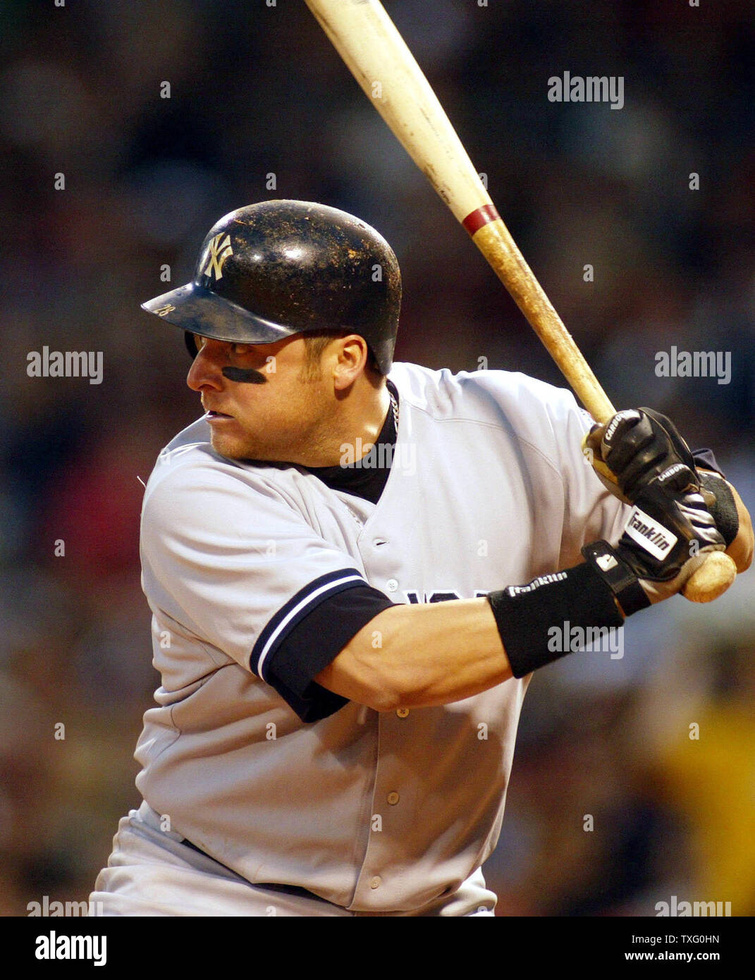 Karim Garcia, of the New York Yankees, awaits a pitch, in the sixth inning, as the New York Yankees face the  Red Sox face, in Game 5, of the American League Championship Series, at Fenway Park, Tuesday, October 14, 2003, in Boston, Massachusetts. The New York Yankees defeated the Boston Red Sox 4-to-2, giving them a one game lead in the Series.  Garcia, and another member of the New York Yankees organization are facing assault and battery charges from the Boston District Attorneys Offices, when they allegedly attacked a member of the Boston Red Sox grounds crew, during Game 3 of the American Stock Photo
