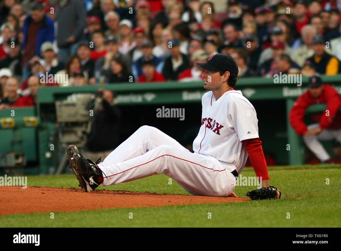 Boston Red Sox pitcher Matt Clement sits on the mound after being