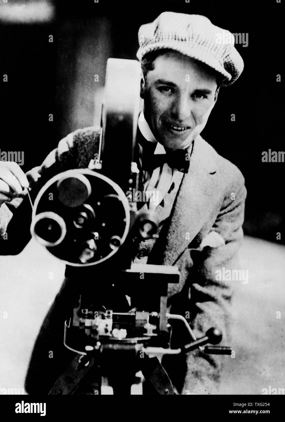 Director, actor, producer Charles Chaplin with camera Ca 1915 Stock Photo