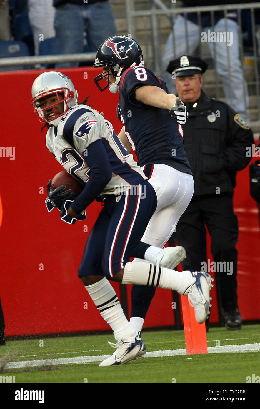 New England Patriots Corner Back Asante Samuel Gets Knocked Out Of Bounds At The Five Yard Line By Houston Texans Quarterback David Carr After Intercepting The Ball At The 38 Yard Line At Gillette