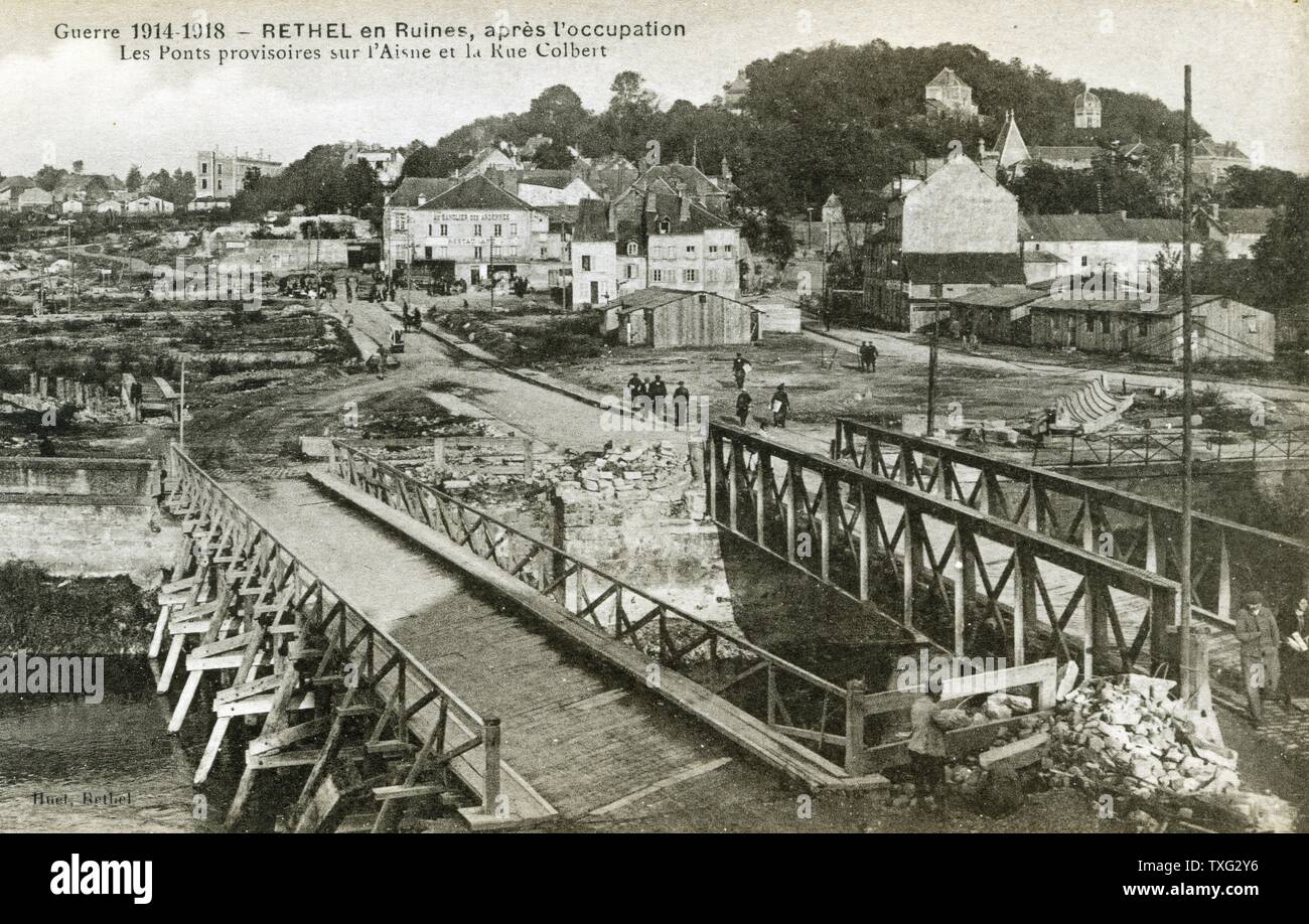 Postcard representing the ruins of the city of Rethel (Ardennes) after the WWI bombings: the temporary bridges on the Aisne river to the rue Colbert. 1918 Stock Photo