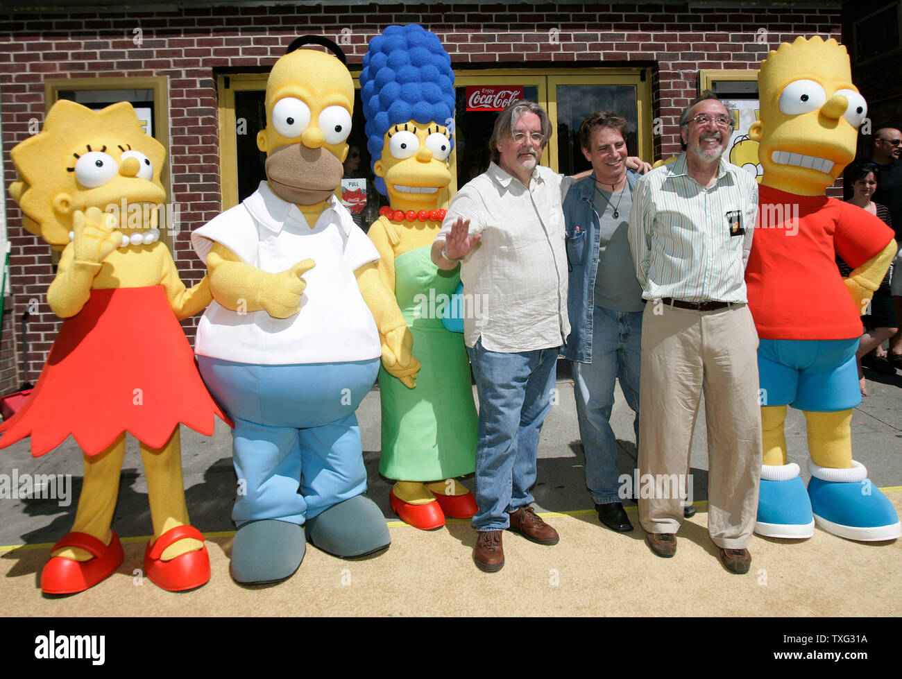 (L-R) Lisa Simpson, Homer Simpson, Marge Simpson, 'The Simpsons Movie' producer Matt Groening, Simpsons director David Silverman, and Simpsons producer James L. Brooks stand for a photo at the hometown premiere of 'The Simpsons Movie' at the Springfield Movie Theater in Springfield, Vermont on July 21, 2007.(UPI Photo/Matthew Healey) Stock Photo