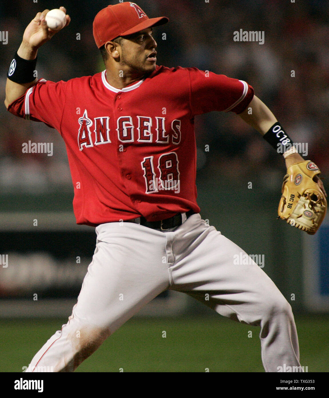 Los Angeles Angels short stop Orlando Cabrera makes the throw to first  baseman Casey Kotchman on a ground out by Boston Red Sox batter Mike Lowell  in the third inning of game