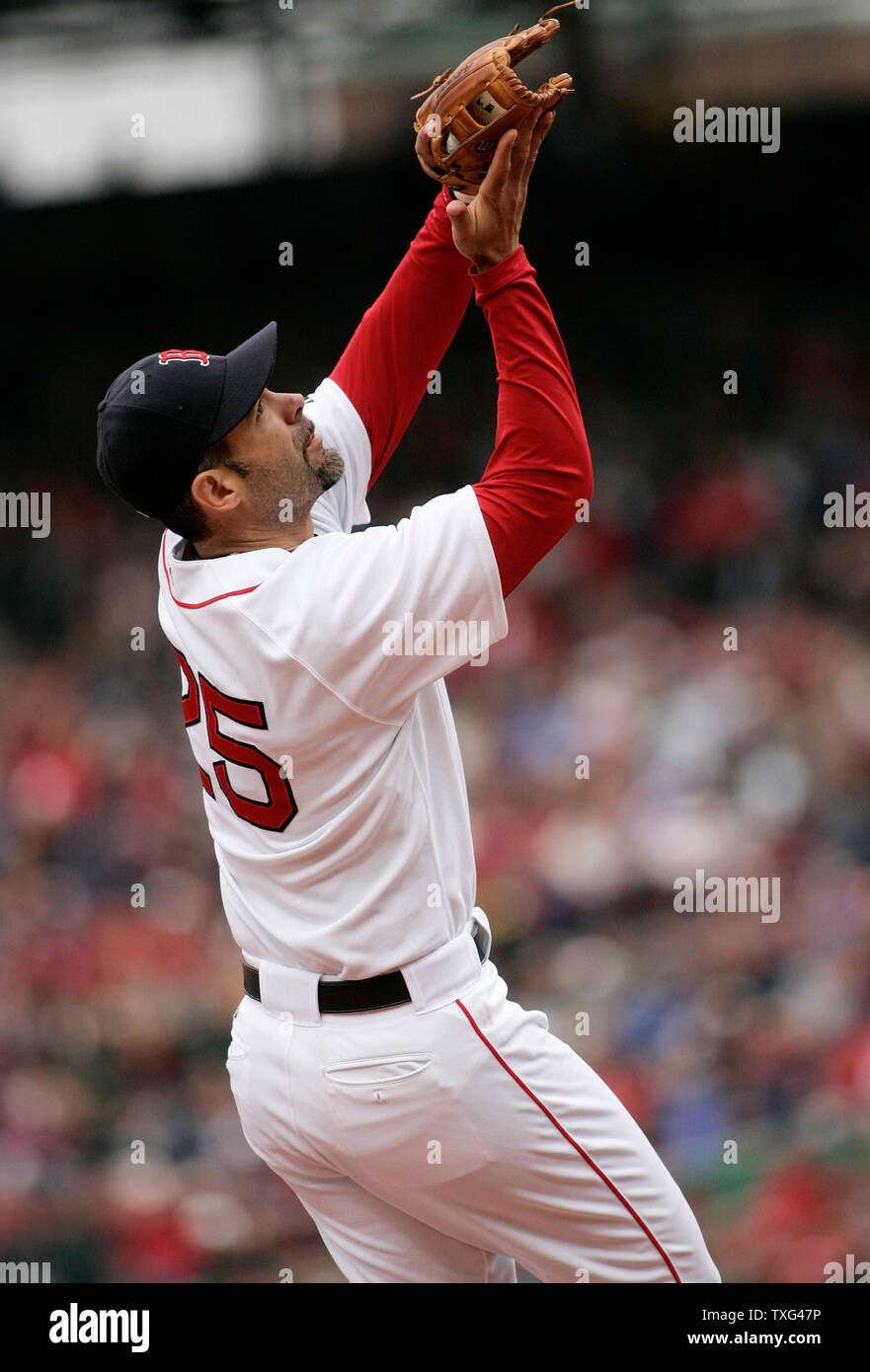 Boston Red Sox third basemen Mike Lowell catches a pop out by Tampa Bay Rays batter Akinori Iwamura in the second inning at Fenway Park in Boston, Massachusetts on May 4, 2008.  (UPI Photo/Matthew Healey) Stock Photo