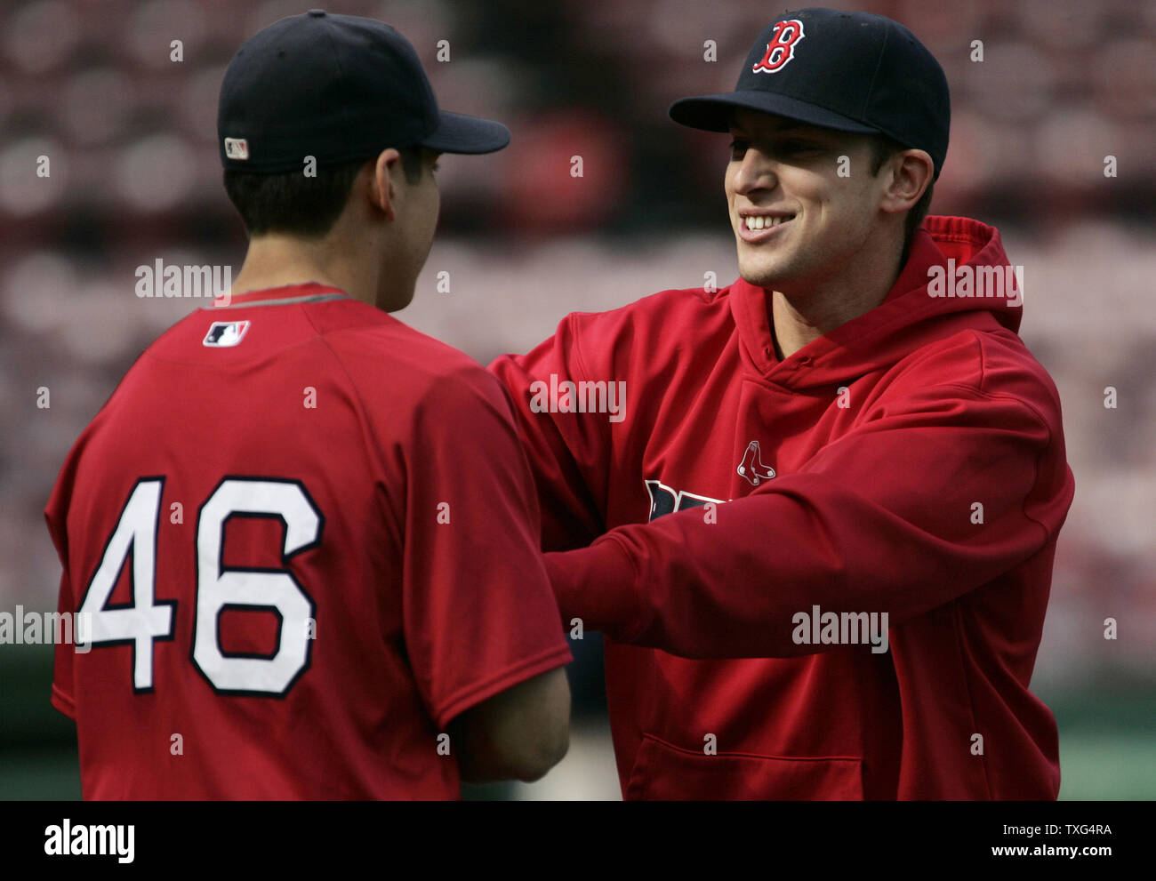 Boston Red Sox center fielder Jacoby Ellsbury (46) jokes around with  teammate Jed Lowrie before game three of the ALCS against the Tampa Bay  Rays at Fenway Park in Boston, Massachusetts on
