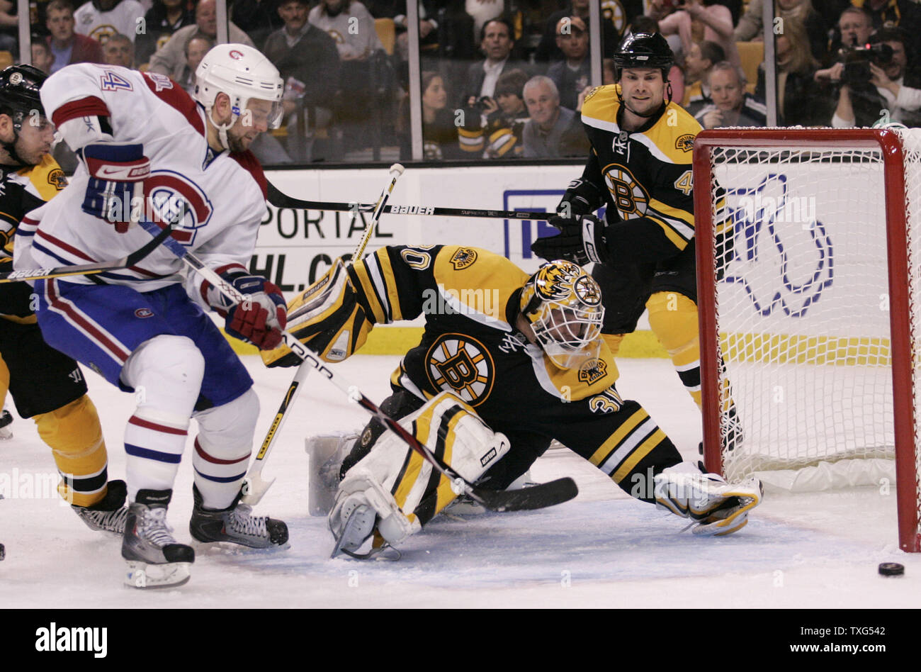 Montreal Canadiens left wing Guillaume Latendresse (84) sends a shot just wide of Boston Bruins goalie Tim Thomas (30) in the second period at TD Banknorth Garden in Boston, Massachusetts on April 16, 2009.  The Bruins defeated the Canadiens 4-2.  (UPI Photo/Matthew Healey) Stock Photo