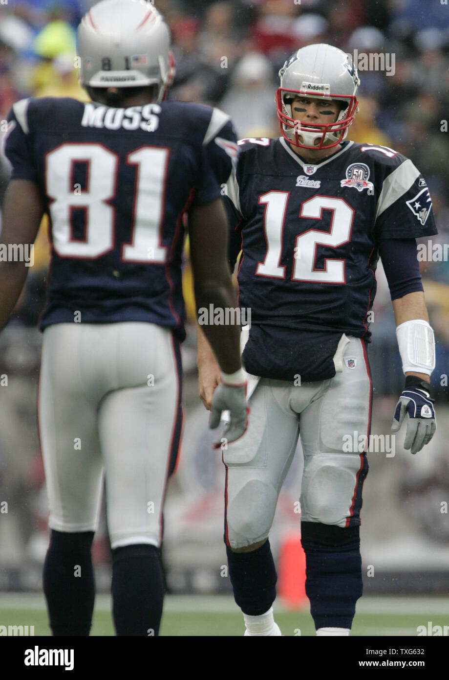 New England Patriots QB Tom Brady (12) chats with wide receiver Randy Moss (81) during the game against the Atlanta Falcons at Gillette Stadium in Foxboro, Massachusetts on September 27, 2009.  The Patriots defeated the Falcons 26-10. UPI/Matthew Healey Stock Photo