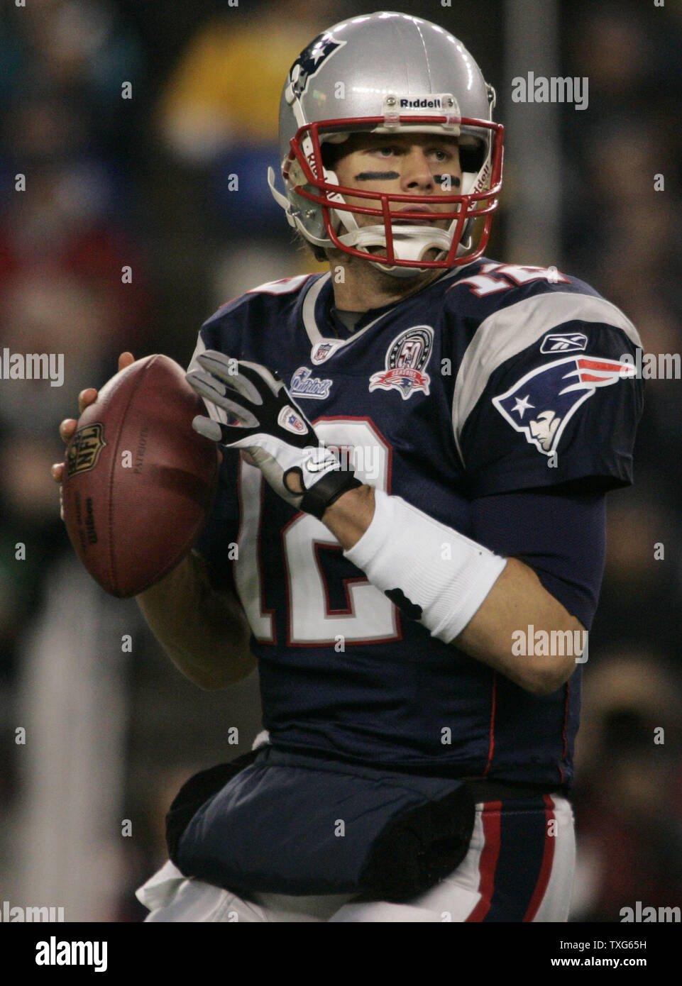 New England Patriots quarterback Tom Brady (12) drops back for a pass against the New York Jets in the first quarter at Gillette Stadium in Foxboro, Massachusetts on November 22, 2009.    UPI/Matthew Healey Stock Photo