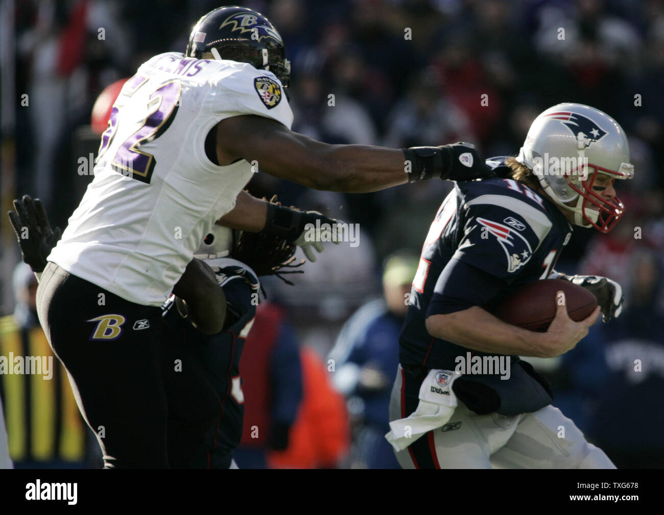 Baltimore Ravens linebacker Ray Lewis (52) drags down New England Patriots quarterback Tom Brady (12) for a sack in the first quarter of the AFC Wildcard game at Gillette Stadium in Foxboro, Massachusetts on January 10, 2010.    UPI/Matthew Healey Stock Photo