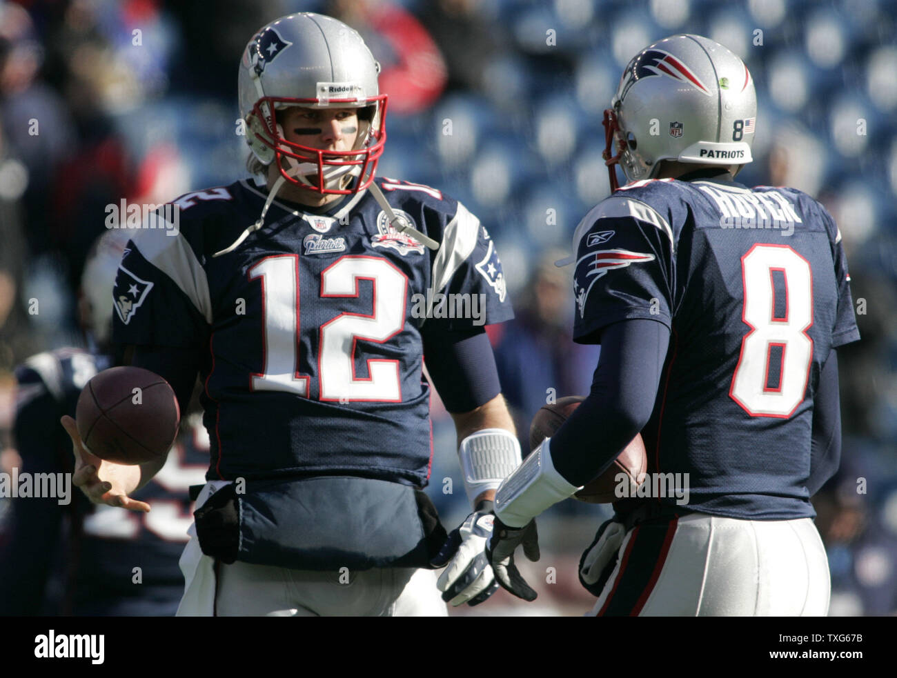 New England Patriots quarterback Tom Brady (12) chats with quarterback Brian Hoyer (8) during warm ups before the game against the Baltimore Ravens at Gillette Stadium in Foxboro, Massachusetts on January 10, 2010.    UPI/Matthew Healey Stock Photo