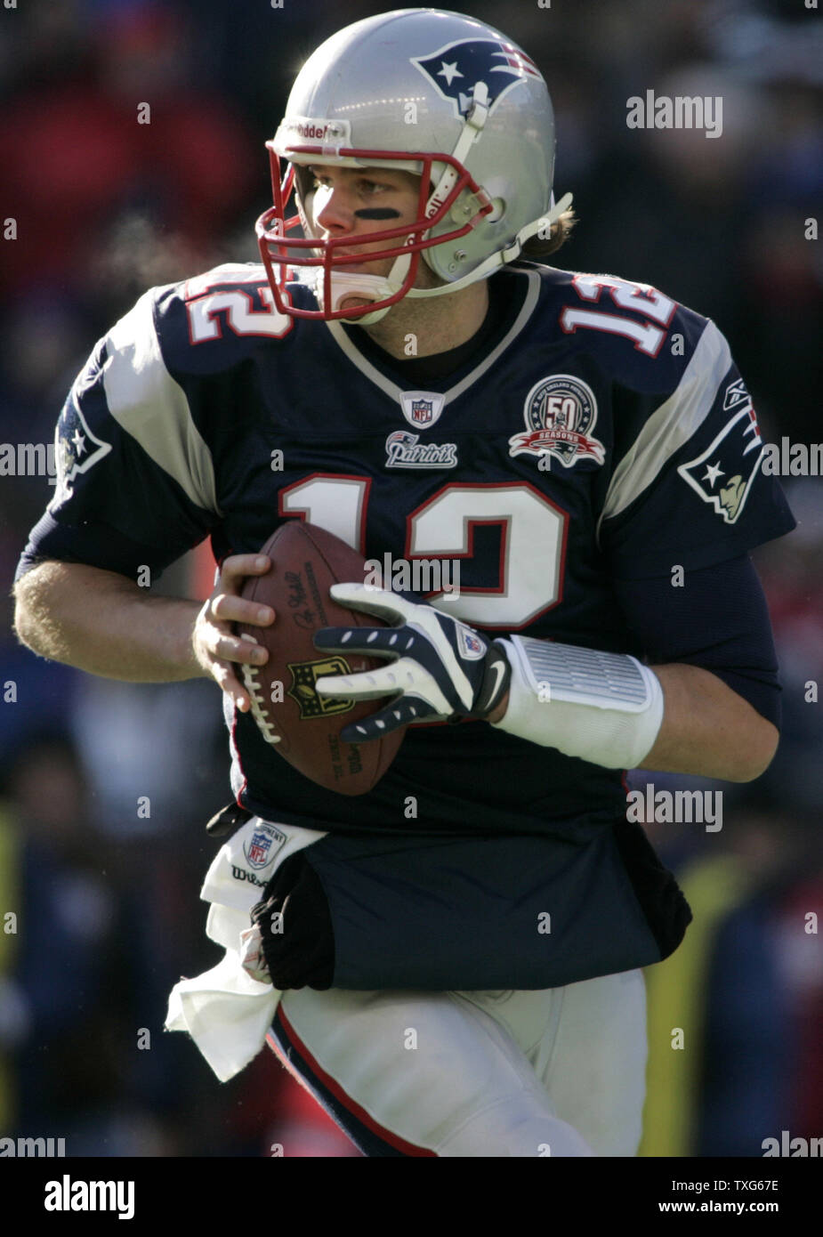 New England Patriots quarterback Tom Brady (12) rolls out for a pass in the first quarter against the Baltimore Ravens at Gillette Stadium in Foxboro, Massachusetts on January 10, 2010.  The Ravens defeated the Patriots 33-14.   UPI/Matthew Healey Stock Photo