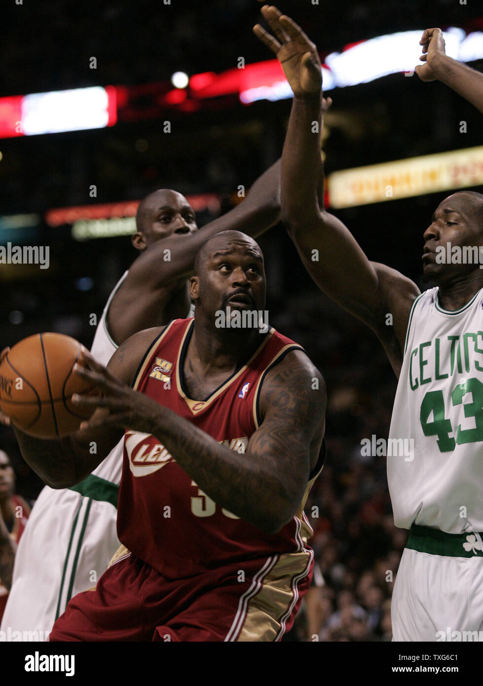 Cleveland Cavaliers center Shaquille O'Neal (33) drives to the net between Boston Celtics forward Kevin Garnett (L) and Boston Celtics center Kendrick Perkins (43) in the first half at the TD Garden in Boston, Massachusetts on February 25, 2010.   UPI/Matthew Healey Stock Photo