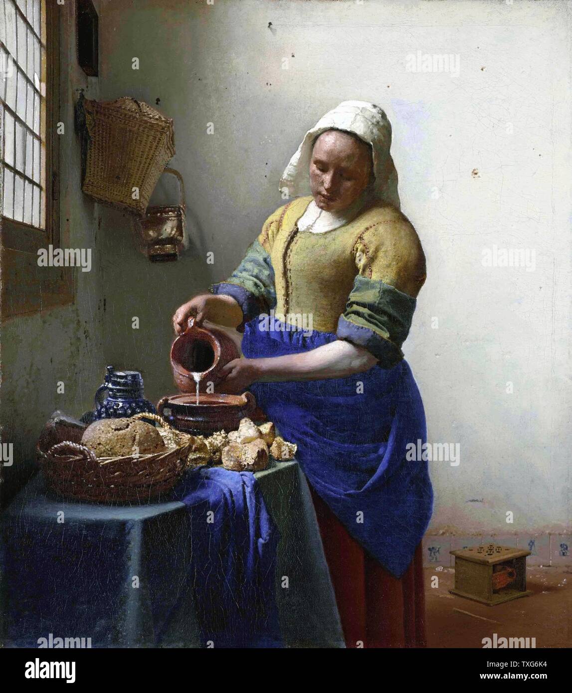 Johannes Vermeer Dutch school  The Milkmaid c.1660 Oil on canvas (45.5 x 41 cm) Amsterdam, Rijksmuseum Stock Photo