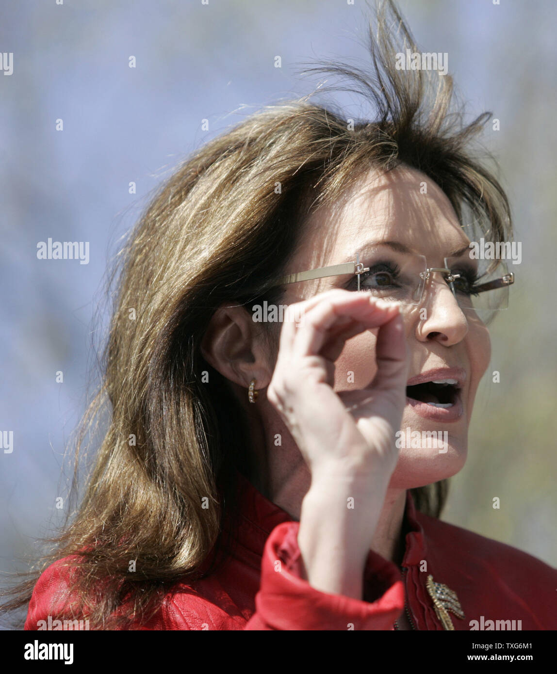 The wind blows back the hair of former Alaska Governor Sarah Palin as she addresses the crowd at a Tea Party Express rally on Boston Common in Boston, Massachusetts on Wednesday, April 14, 2010.     UPI/Matthew Healey Stock Photo