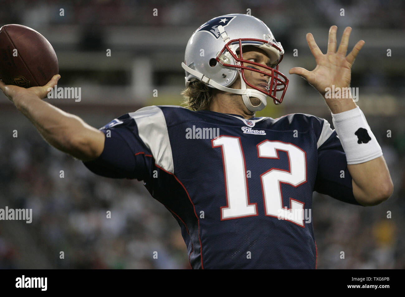 New England Patriots quarterback Tom Brady warms up his arm during a timeout in the first quarter of preseason action against the New Orleans Saints at Gillette Stadium in Foxboro, Massachusetts on August 12, 2010.      UPI/Matthew Healey Stock Photo